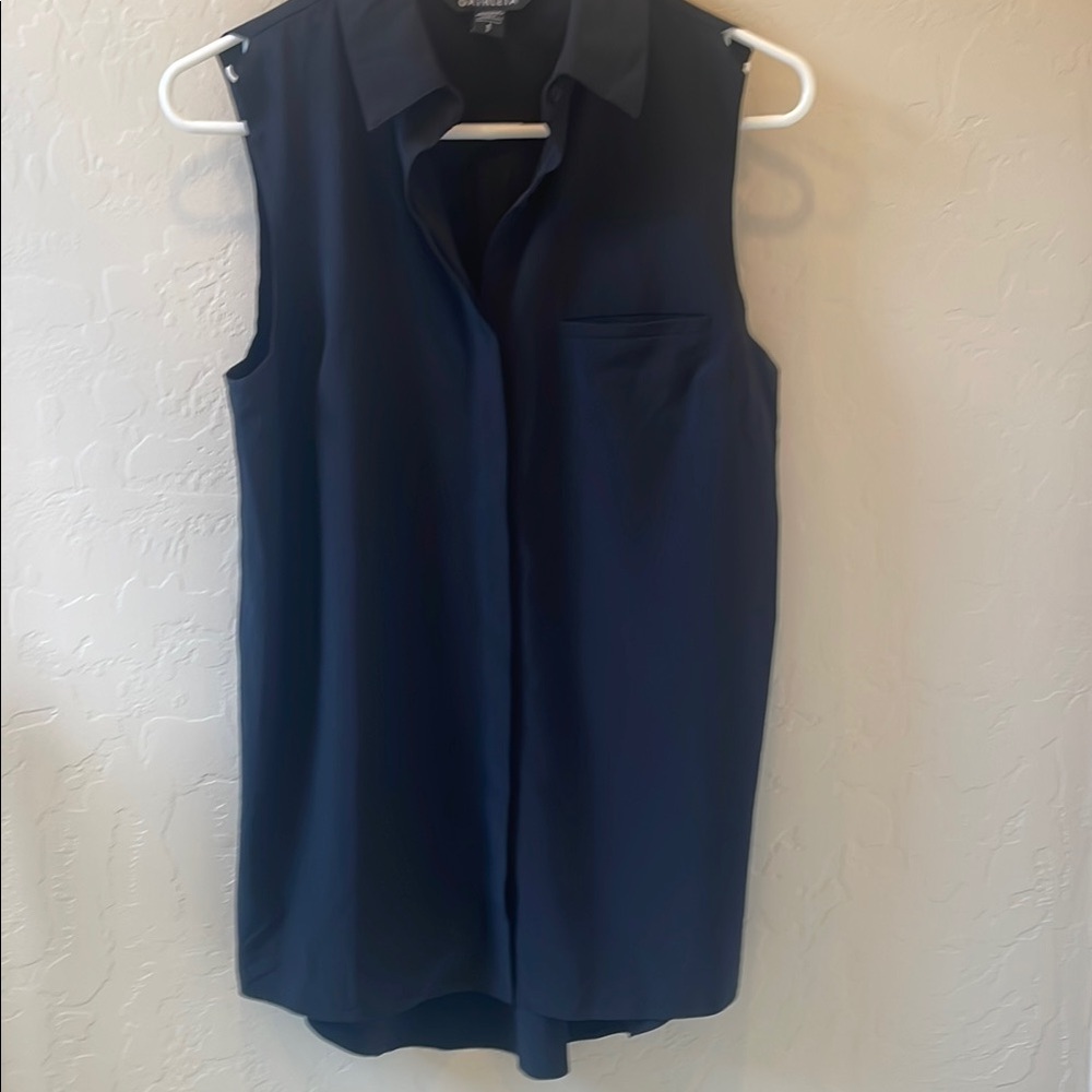 Athleta S sleeveless black button down (placket covers buttons) collared top.